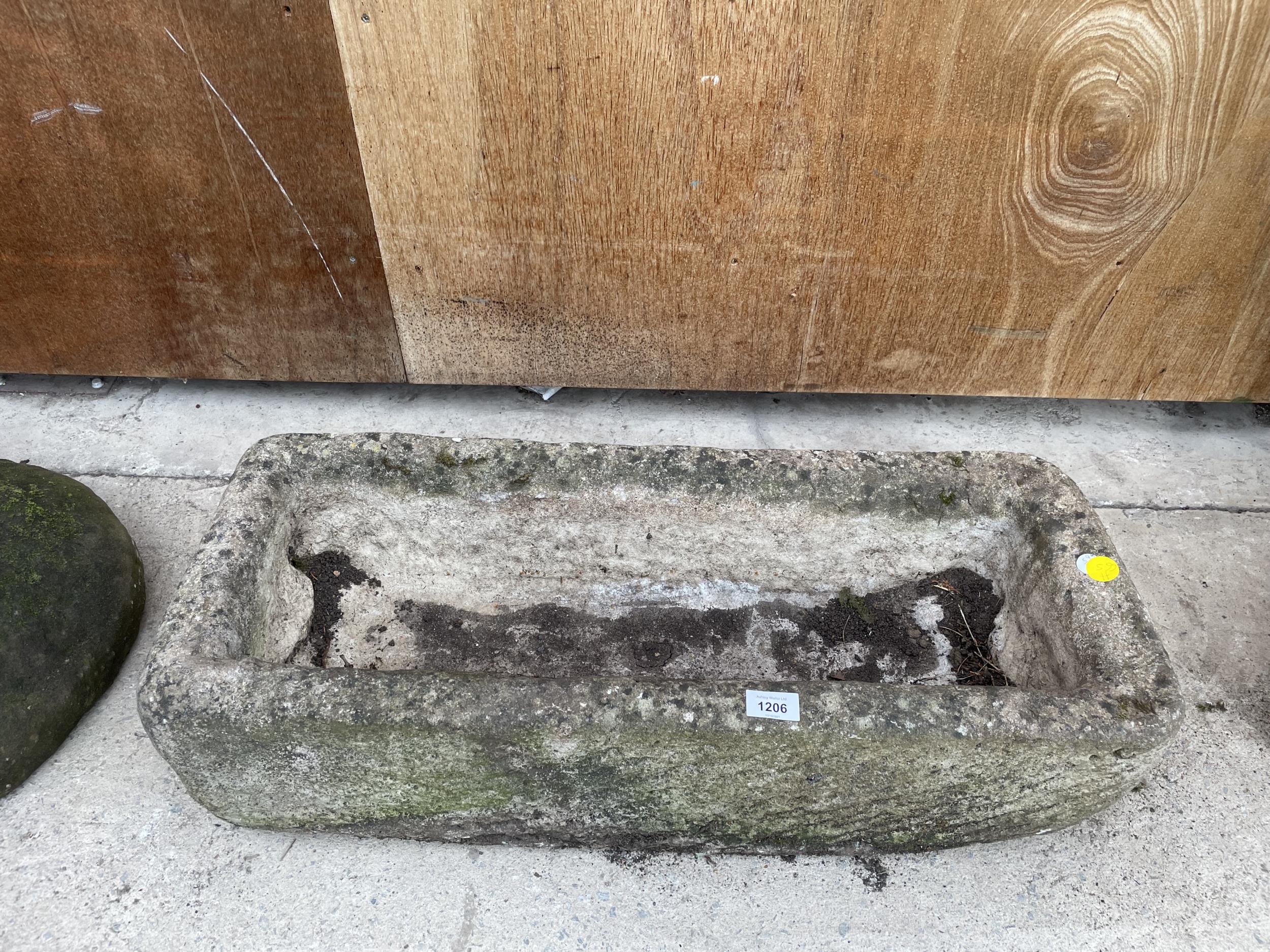 A STONE TROUGH - APPROXIMATELY 75 CM WIDE