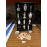 A SMALL DISPLAY CABINET WITH MINIATURE ORIENTAL STYLE VASES. ALSO INCLUDES INFORMATION CARDS AND TWO