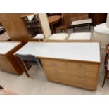 A 20TH CENTURY EX.WD DRESSING TABLE, STAMPED PAP.IND.OCT.1977, 60" WIDE, ENCLOSING FIVE DRAWERS,