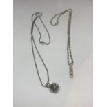 TWO SILVER NECKLACES WITH PENDANTS TO INCLUDE A SMALL INGOT AND A CAGED BALL