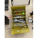 A METAL TOOL BOX CONTAINING AN ASSORTMENT OF SPANNERS, SCREW DRIVERS AND PLIERS ETC