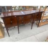 A MAHOGANY AND INLAID REGENCY STYLE SERPENTINE FRONT SIDEBOARD ON TAPERED LEGS, 65" WIDE