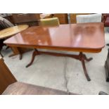 A MODERN YEW WOOD EXTENDING DINING TABLE