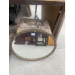 A DECORATIVE FRAMED MIRROR AND AN UPHOLSTERED LIDDED STOOL