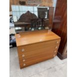 A RETRO TEAK DRESSING CHEST ENCLOSING FOUR DRAWERS 32" WIDE