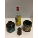 A VINTAGE WOODEN BOTTLE HOLDER DEPICTING A TROPICAL PAINTED SCENE