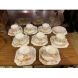 AN OSBORNE CHINA DECO PART TEA SET TO INCLUDE CUPS, SAUCERS, PLATES ETC