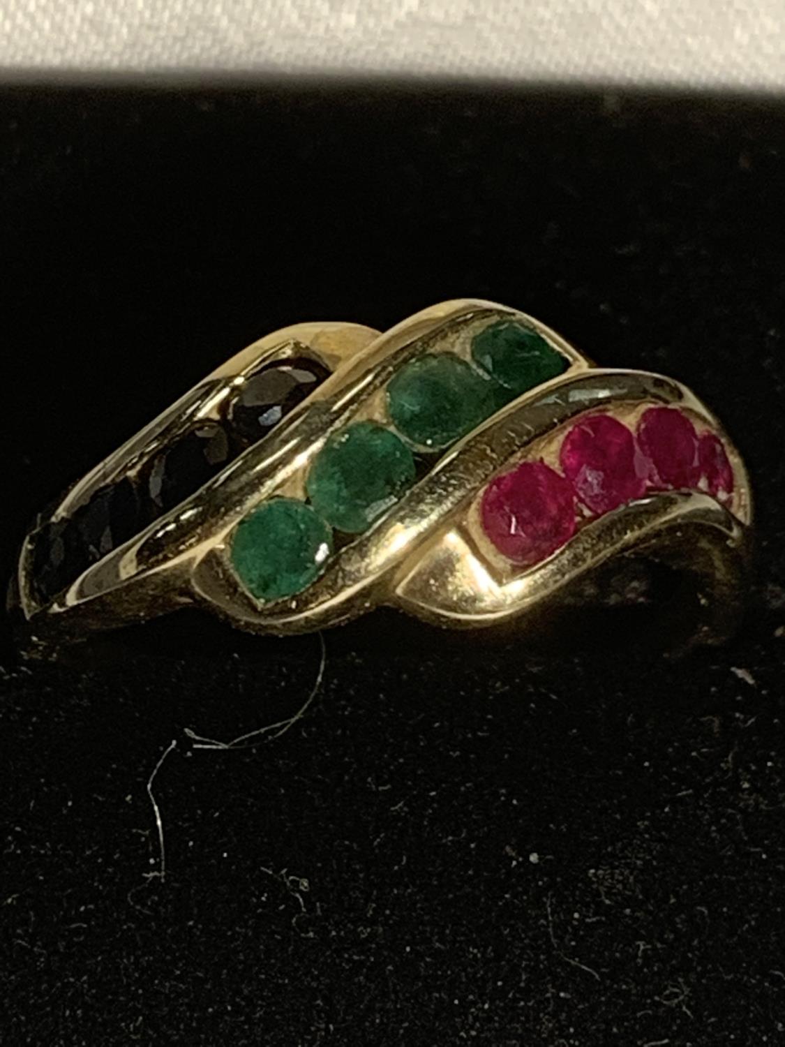 A 9 CARAT GOLD RING WITH TWELVE COLOURED STONES SIZE Q GROSS WEIGHT 2.8 GRAMS