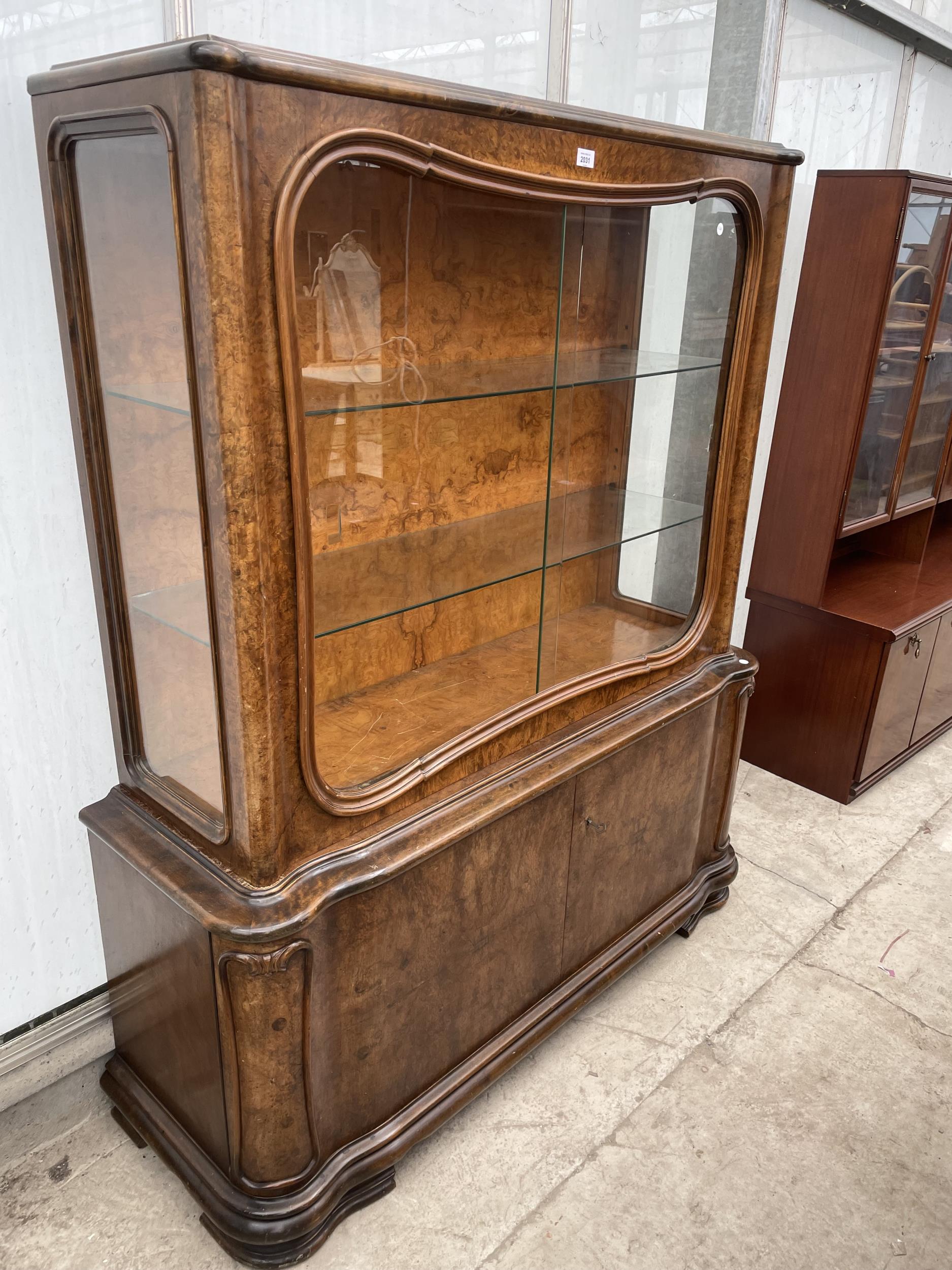 A BURR WALNUT ART DECO DISPLAY CABINET WITH SLIDING GLASS DOORS TO THE UPPER PORTION AND CUPBOARDS