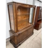 A BURR WALNUT ART DECO DISPLAY CABINET WITH SLIDING GLASS DOORS TO THE UPPER PORTION AND CUPBOARDS