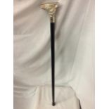 A WOODEN WALKING CANE WITH A SILVER COLOURED FOX HANDLE
