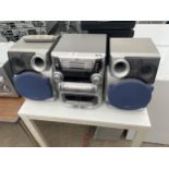 A JVC STEREO SYSTEM WITH A PAIR OF SPEAKERS
