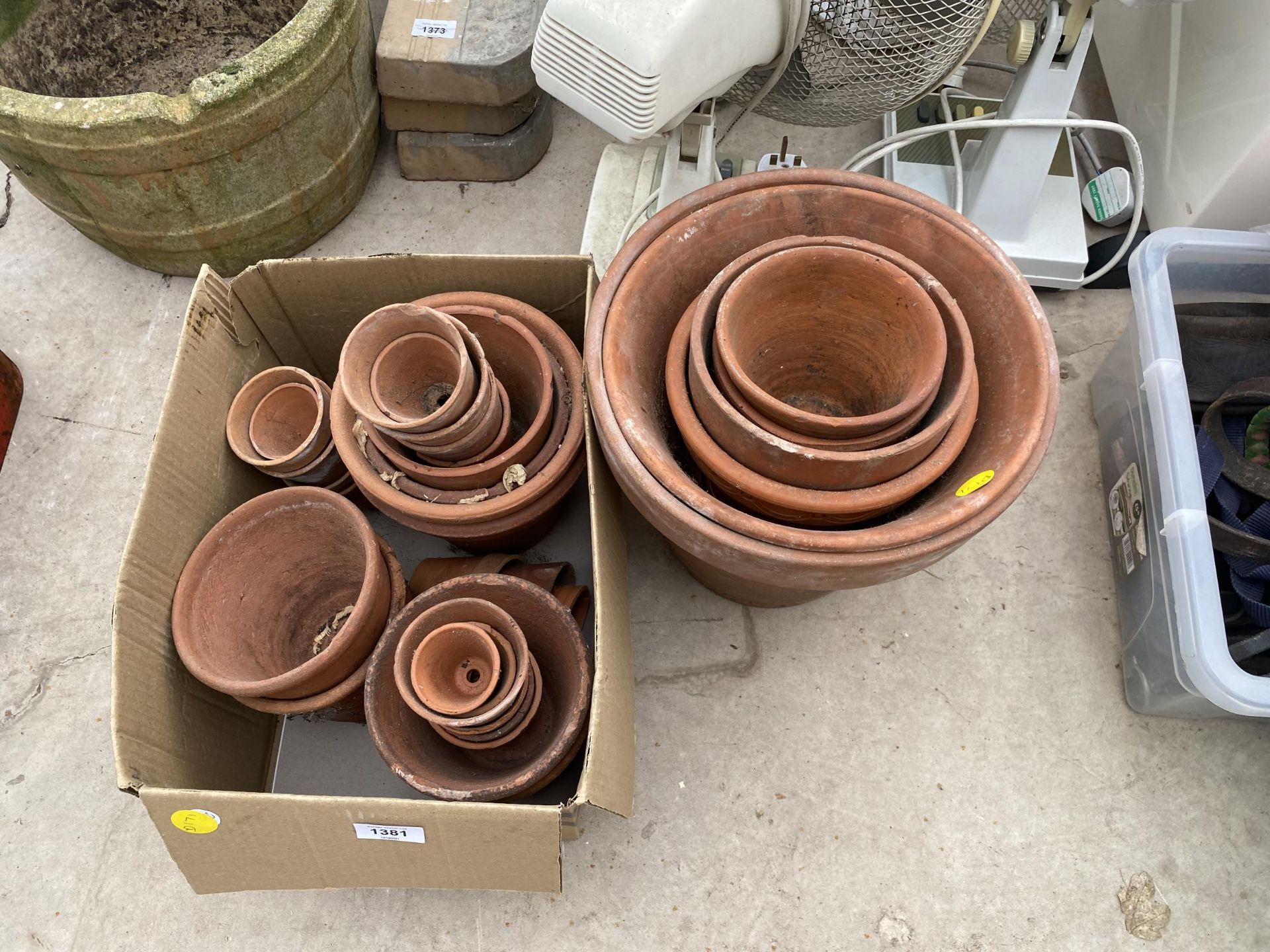 AN ASSORTMENT OF TERRACOTTA PLANT POTS