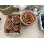 AN ASSORTMENT OF TERRACOTTA PLANT POTS