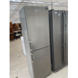 A SILVER UPRIGHT GRUNDIG FRIDGE FREEZER