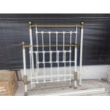 A BRASS AND WHITE PAINTED BED WITH HEAD BOARD AND FOOT BOARD