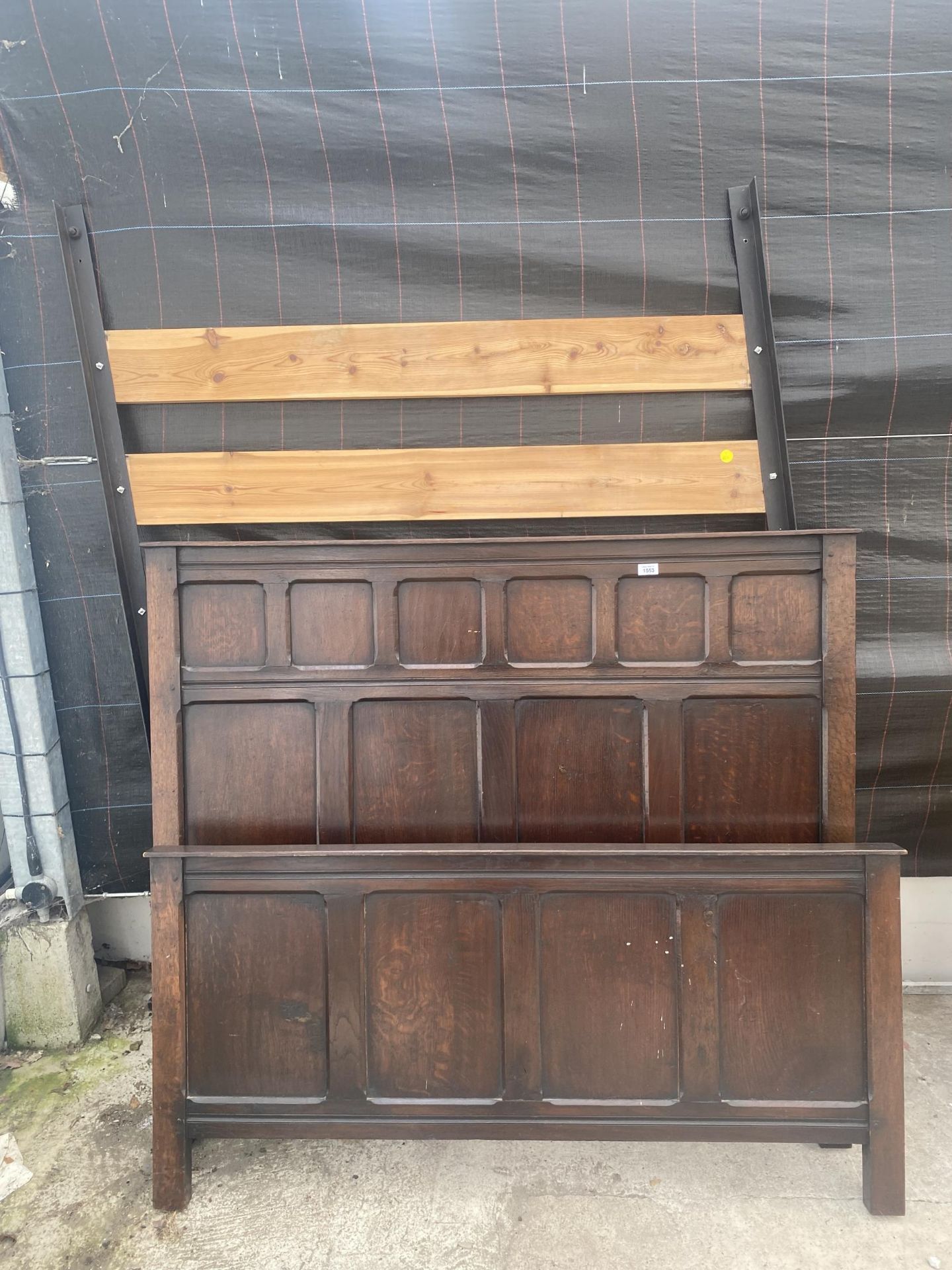 A VINTAGE BED WITH AN OAK HEAD BOARD AND FOOT BOARD