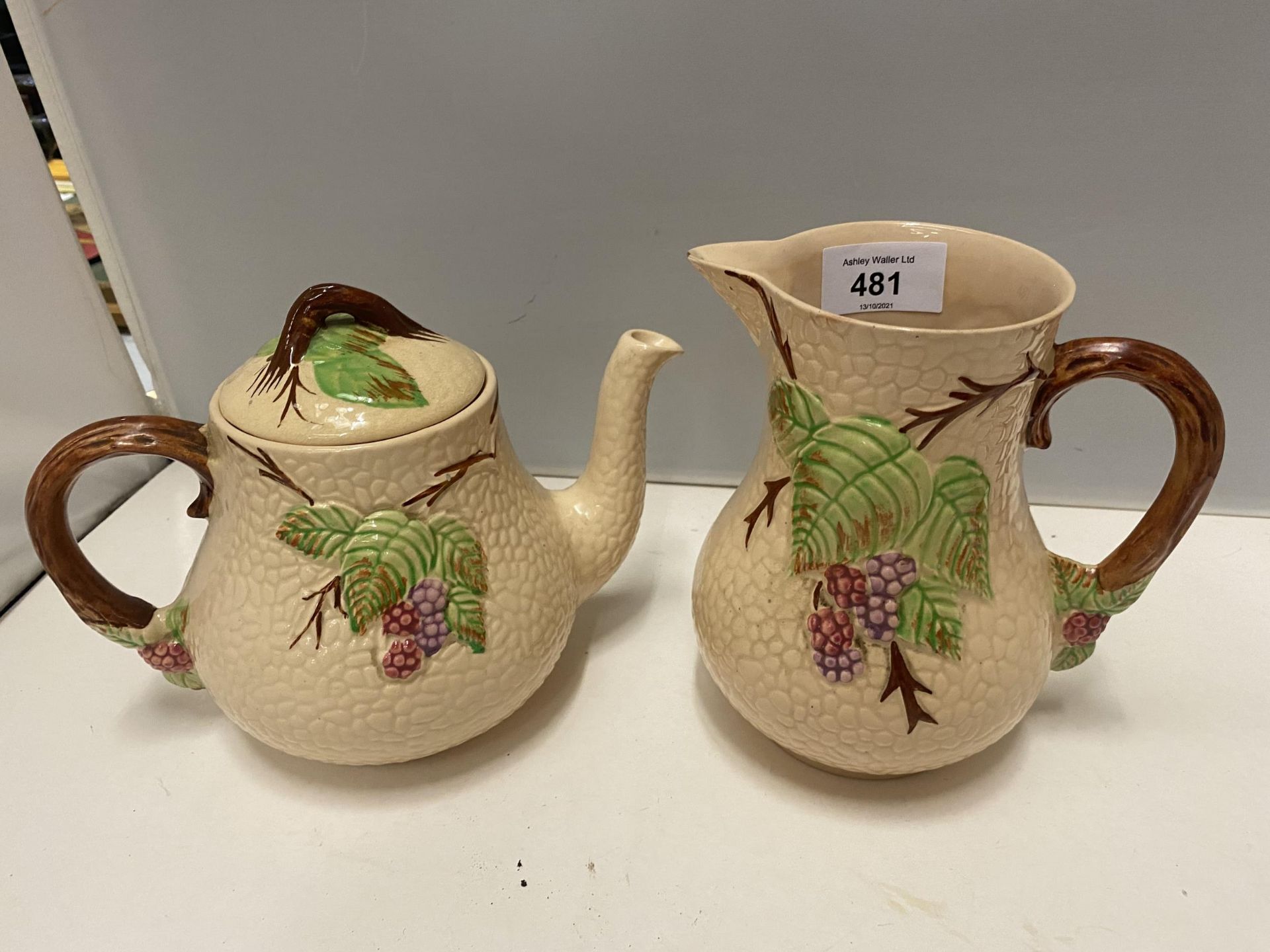 TWO PIECES OF WADE CHINA TO INCLUDE A TEA POT AND JUG WITH BRAMBLE DESIGN