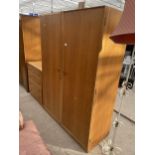 AN OAK MEREDEW TWO DOOR WARDROBE AND CHEST OF FOUR DRAWERS