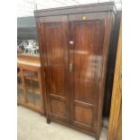 AN EDWARDIAN MAHOGANY GENTS WARDROBE