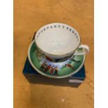 A BOXED ROYAL WORCESTER GOLFING THEME CUP AND SAUCER