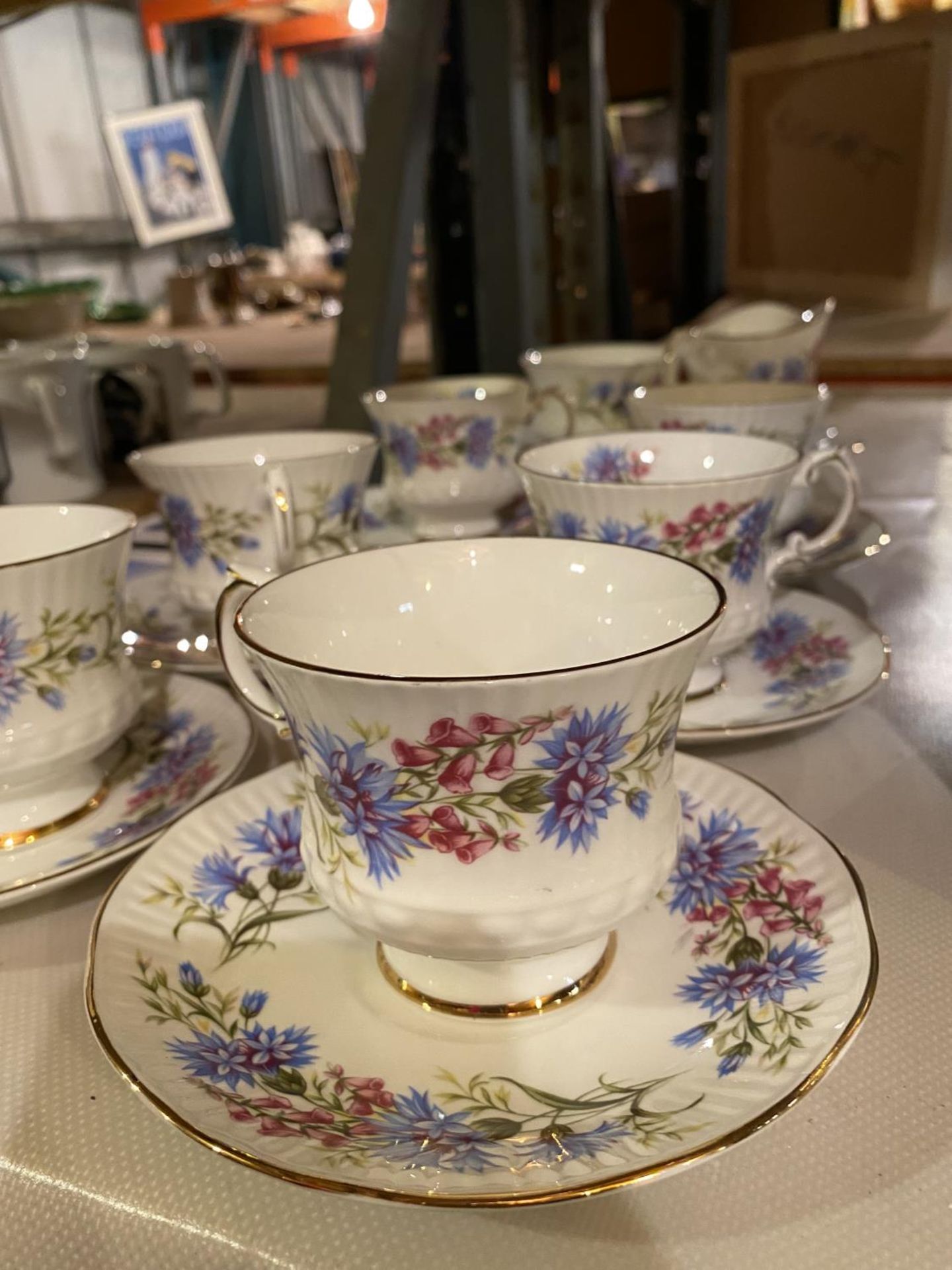 A BONE CHINA PART TEA SET COMPRISING OF SIX CUPS AND SAUCERS, SANDWICH PLATE, MILK JUG AND SUGAR - Image 2 of 4