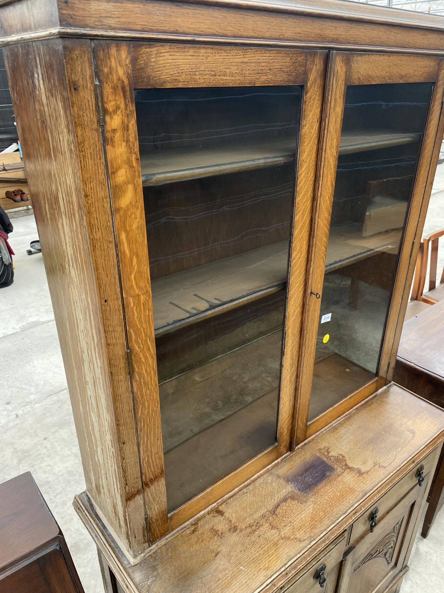 AN EARLY 20TH CENTURY OAK TWO DOOR GLAZED BOOKCASE ON BASE, 42" WIDE - Image 3 of 3