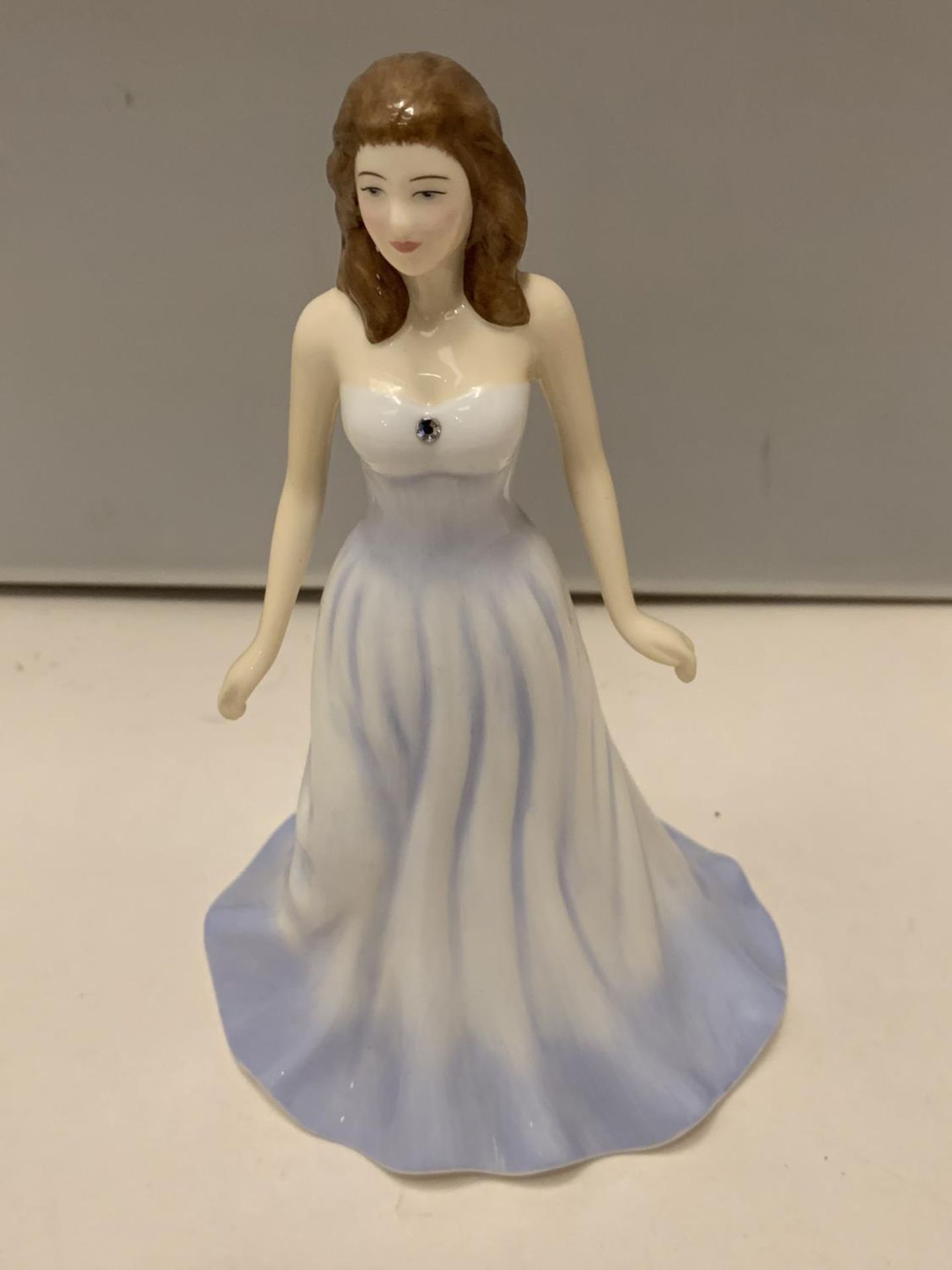 A ROYAL DOULTON GEMSTONES FIGURINE WITH A GENUINE SWAROVSKI CRYSTAL - APRIL - DIAMOND (NO BOX)