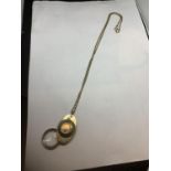 A COMPASS AND MAGNIFYING GLASS ON A CHAIN