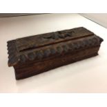 A CARVED TREEN BOX CONTAINING FODENS MATCHES