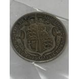 A SILVER GEORGE V HALF CROWN 1915