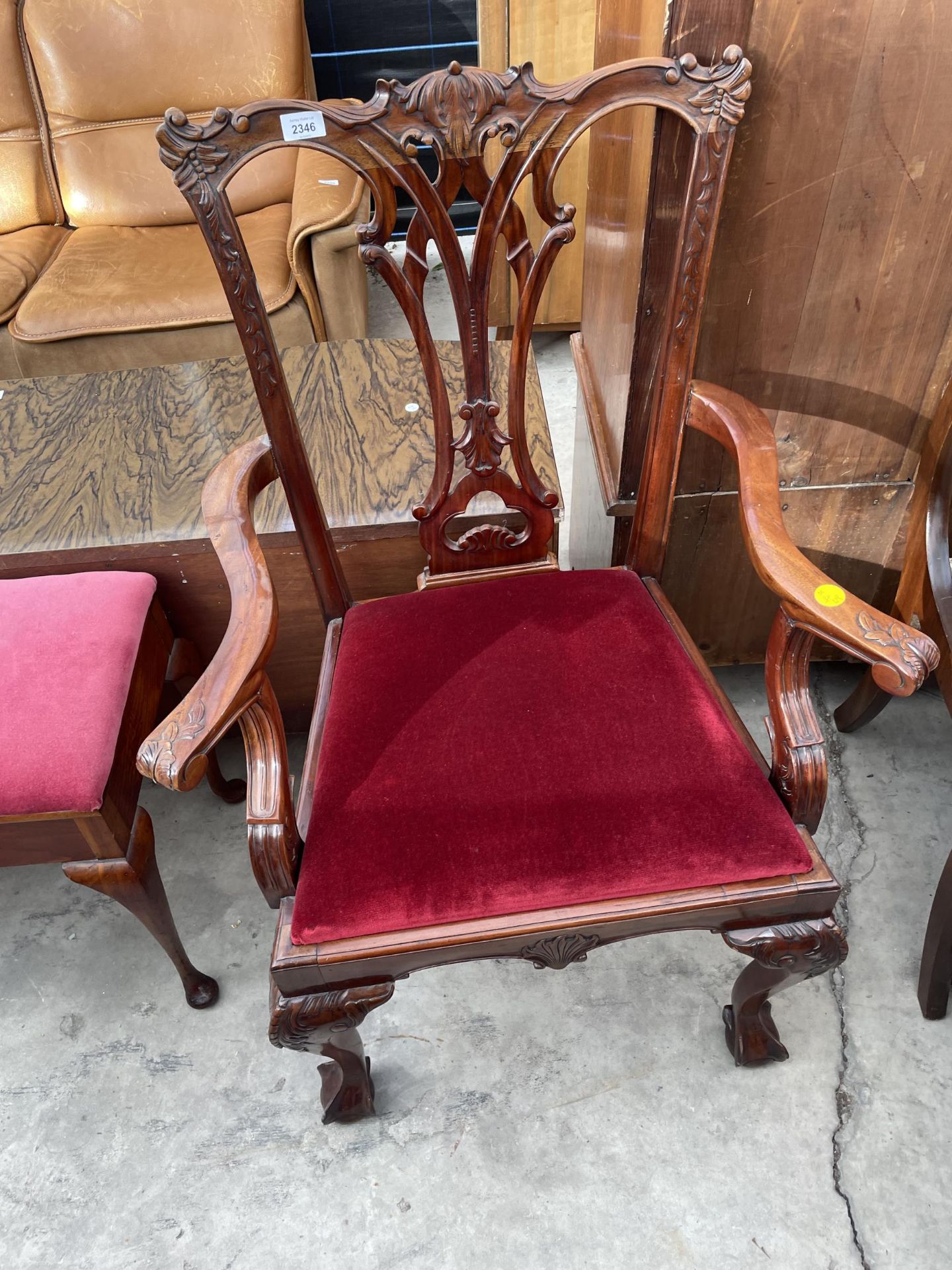 A MAHOGANY CHIPPENDALE STYLE CARVER CHAIR ON BALL AND CLAW FRONT FEET