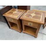 A PAIR OF MODERN HARDWOOD BEDSIDE LOCKERS INSET WITH MARBLE