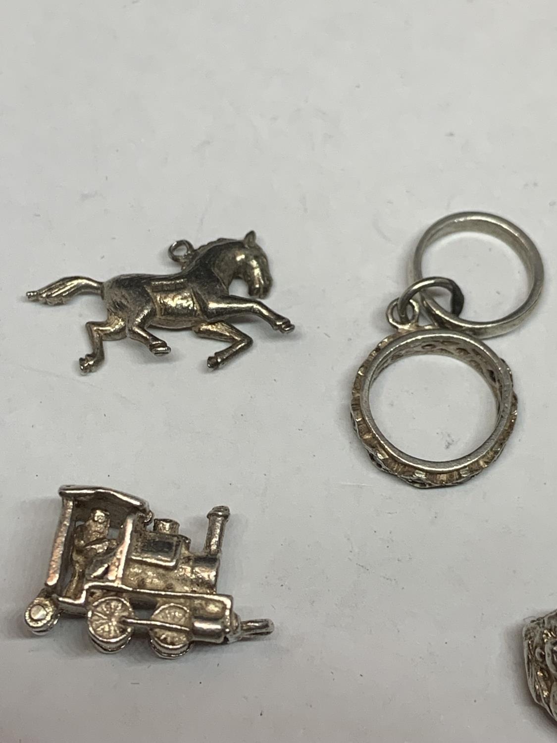 ELEVEN VARIOUS SILVER CHARMS TO INCLUDE HORSES, MOULIN ROUGE DANCER, DOG, TRAIN CHURCH ETC - Image 2 of 5