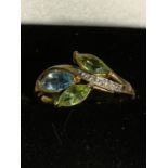 A 9 CARAT GOLD RING WITH THREE COLOURED LEAF SHAPED STONES AND A LINE OF CLEAR STONES SIZE P GROSS