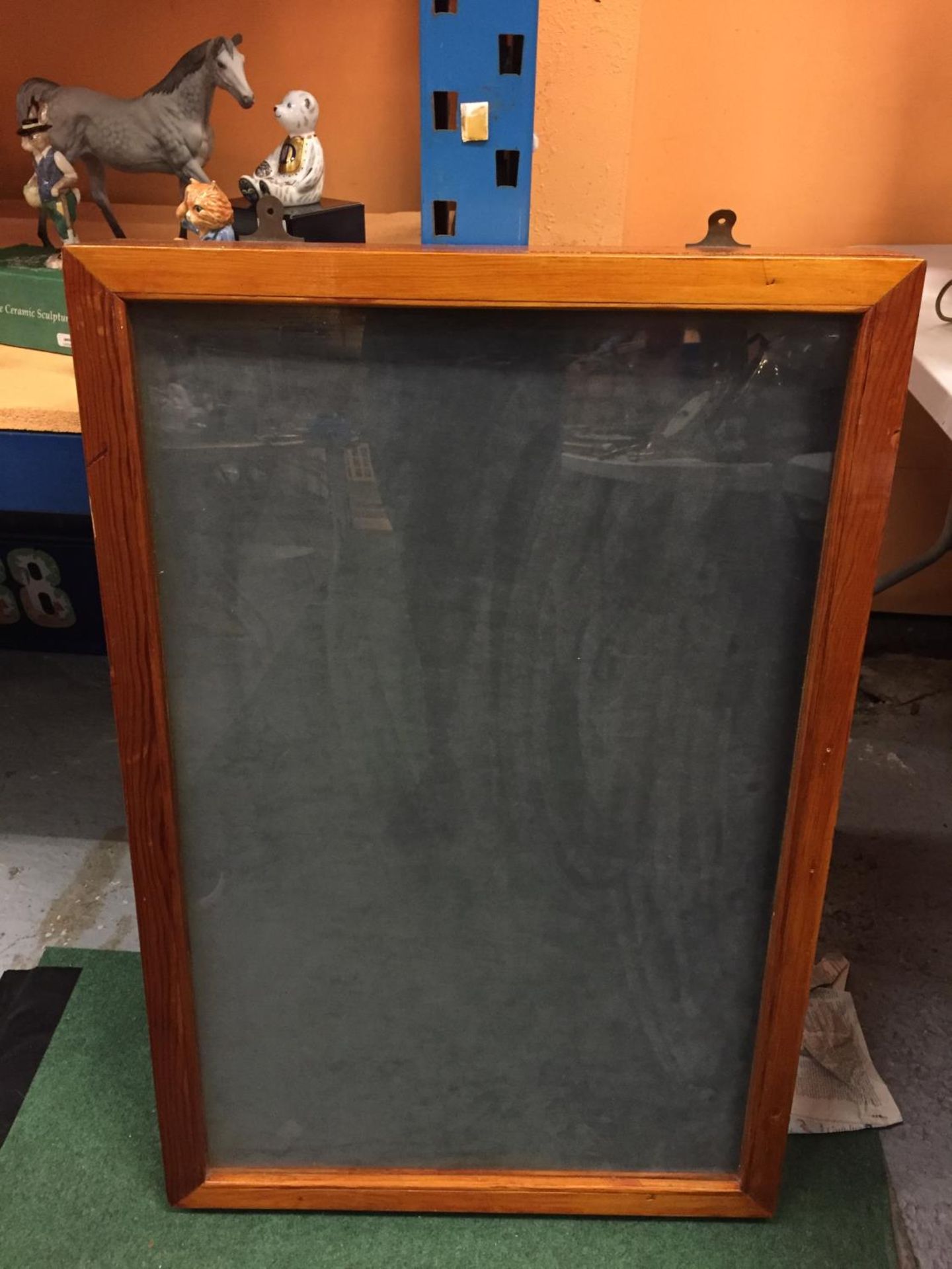 A WOODEN FRAMED COUNTER TOP DISPLAY CABINET