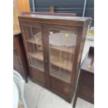 AN EARLY 20TH CENTURY OAK GLAZED AND LEADED BOOKCASE, 35" WIDE