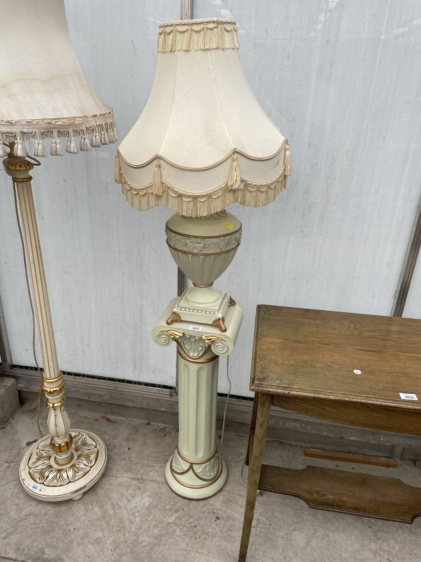 A MODERN TABLE LAMP STANDING ON CORINTHIAN STYLE COLUMN, COMPLETE WITH SHADE