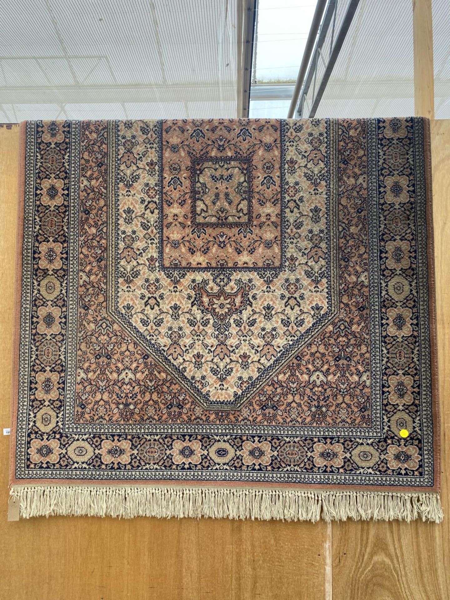 A LARGE PATTERNED KESHAN SUPER RUG