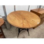 A MODERN PINE KITCHEN TABLE, 36" DIAMETER, ON METAL BENTWOOD STYLE BASE