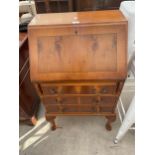 A MODERN YEW WOOD BUREAU ON CABRIOLE LEGS, 23" WIDE