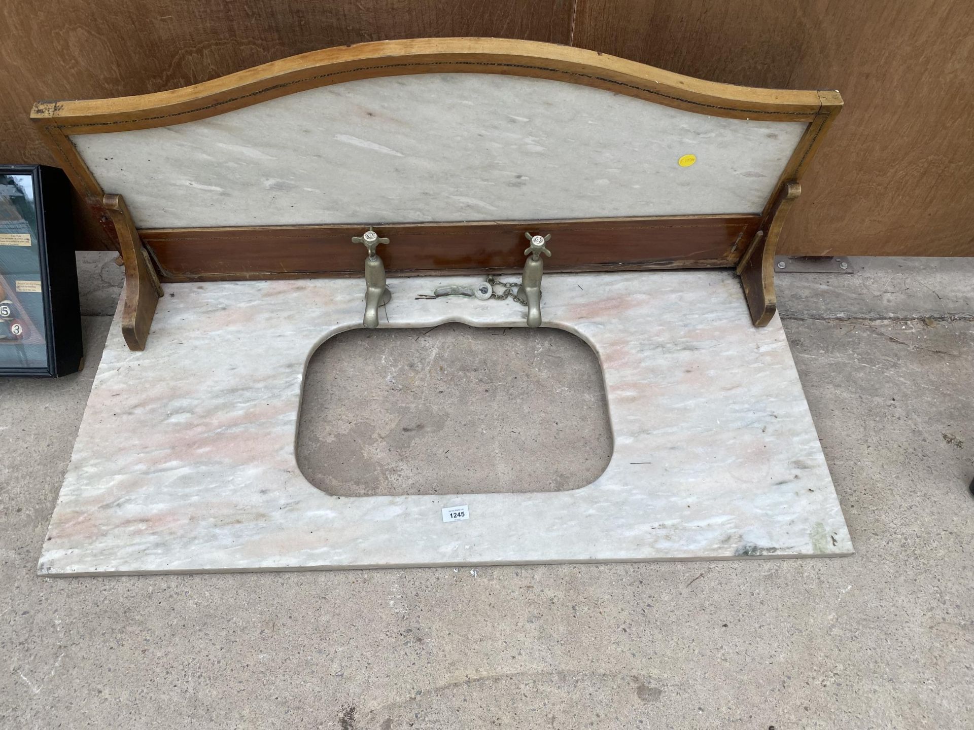 A VINTAGE MARBLE WASH BASIN TOP WITH BRASS TAPS AND SPLASH BACK