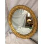 A CONCAVE GOLD GILT FRAMED MIRROR A/F