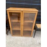 A RETRO TEAK TWO DOOR BOOKCASE, SUTCLIFFE FURNITURE, 33" WIDE