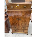 AN ART DECO WALNUT TALLBOY ON CABRIOLE LEGS ENCLOSING CUPBOARD AND DRAWER, 30" WIDE