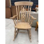 A VICTORIAN STYLE FARMHOUSE ROCKING CHAIR