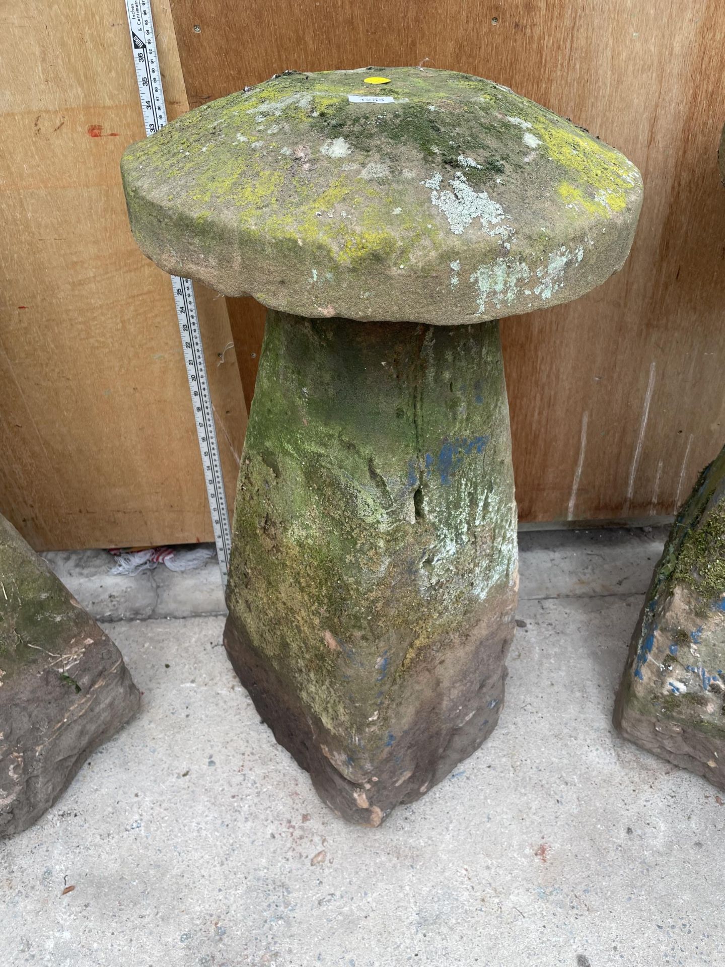 A LARGE STONE STADDLE STONE - APPROXIMATELY 85 CM HIGH