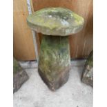 A LARGE STONE STADDLE STONE - APPROXIMATELY 85 CM HIGH