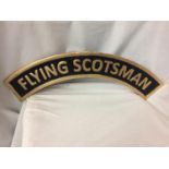 A CAST IRON FLYING SCOTSMAN SIGN