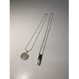 TWO SILVER NECKLACES WITH PENDANTS TO INCLUDE AN ABSTRACT DESIGN AND A ST CHRISTOPHER